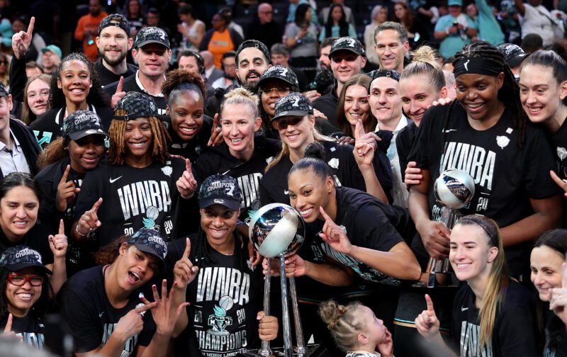 New York Liberty celebrate following 2024 WNBA championship win.