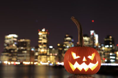 Jack-o'-lantern in Brooklyn, with Manhattan as a backdrop.